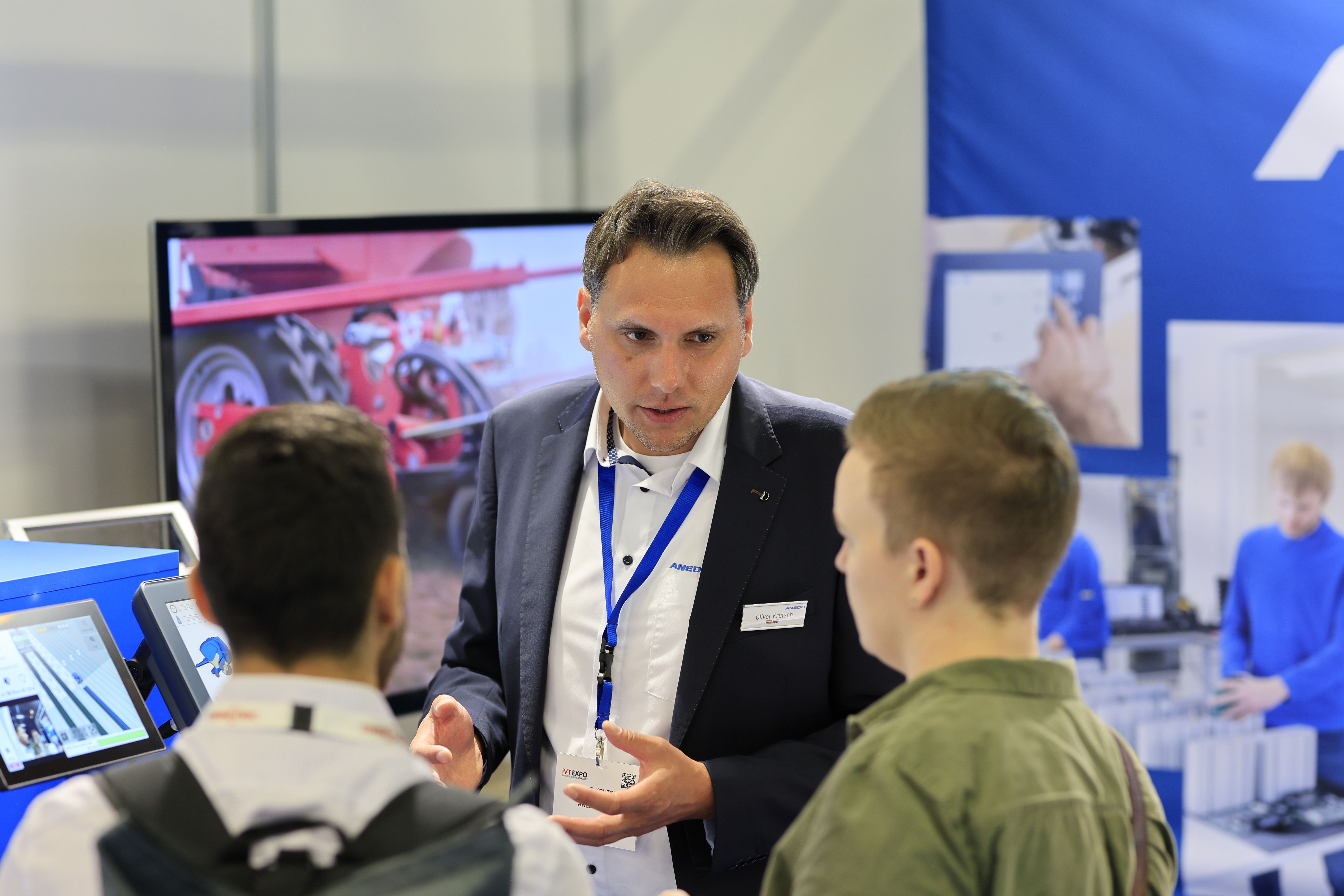 Photo shows a group of people networking at iVT Expo