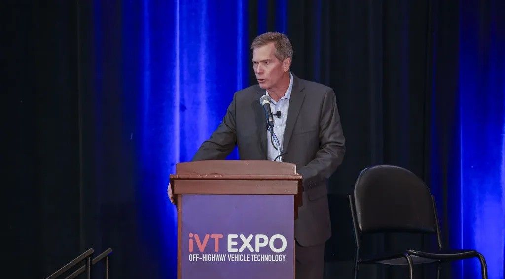 Photo shows a man presenting at the iVT Summit