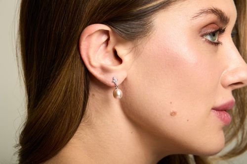 Cubic zirconia studs with pink cultured freshwater pearl teardrops