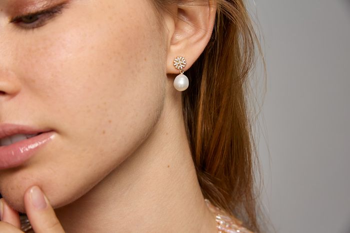 Earrings: Sterling silver pave snowflake studs with pearl drops