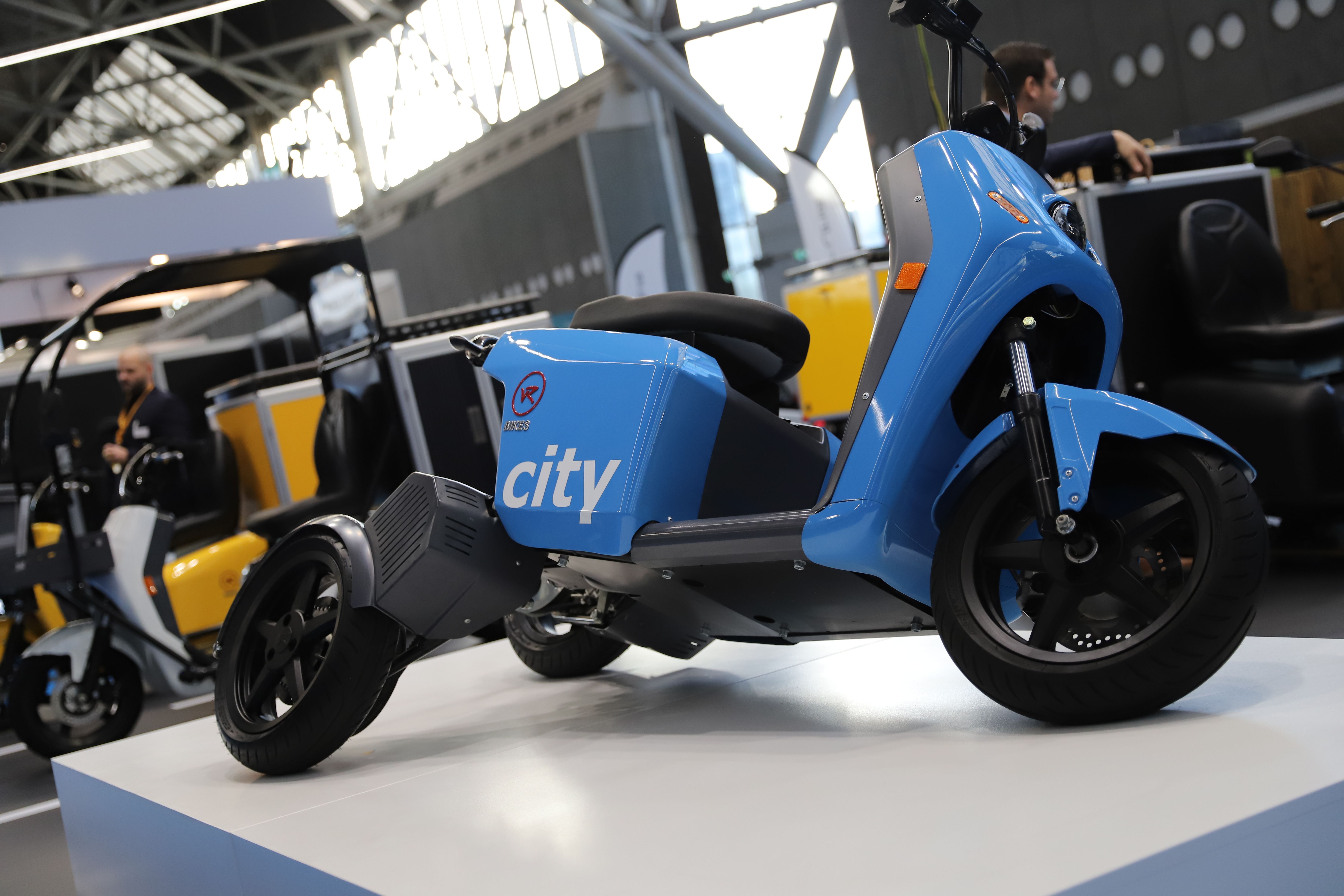 Photo shows an electric motorcycle on display at Parcel and Post Expo