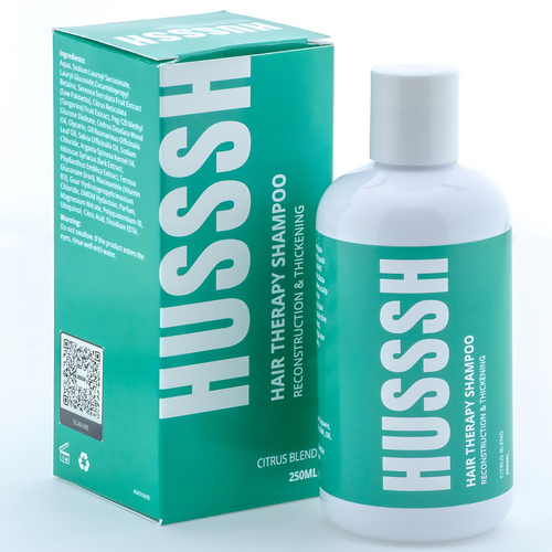 HUSSSH Hair Therapy Shampoo works to reconstruct and thicken hair.