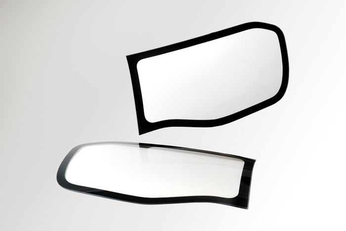 Custom polycarbonate and PMMA headlight covers for motorsport