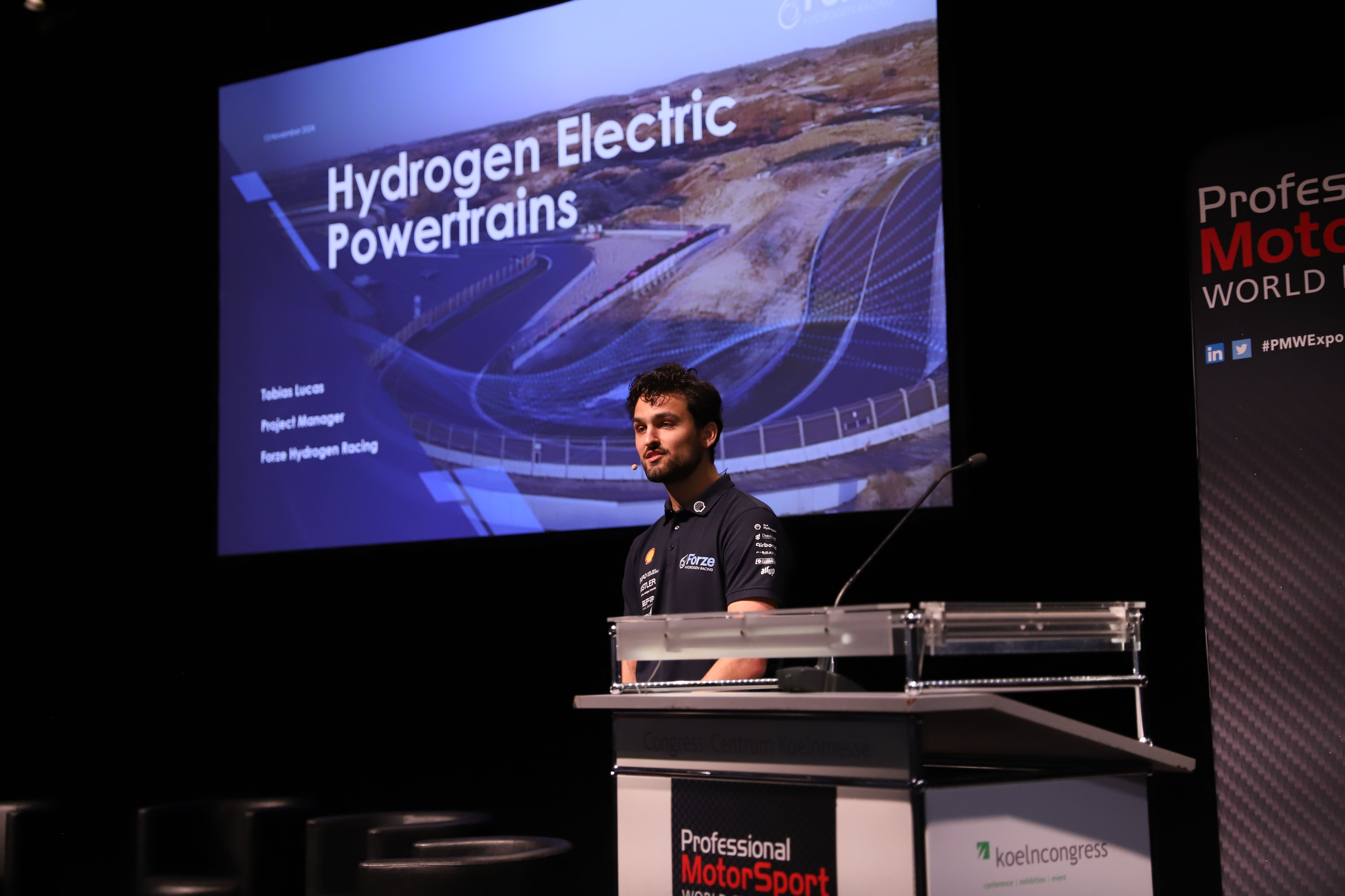 Photo shows a speaker at PMW Powertrain Forum
