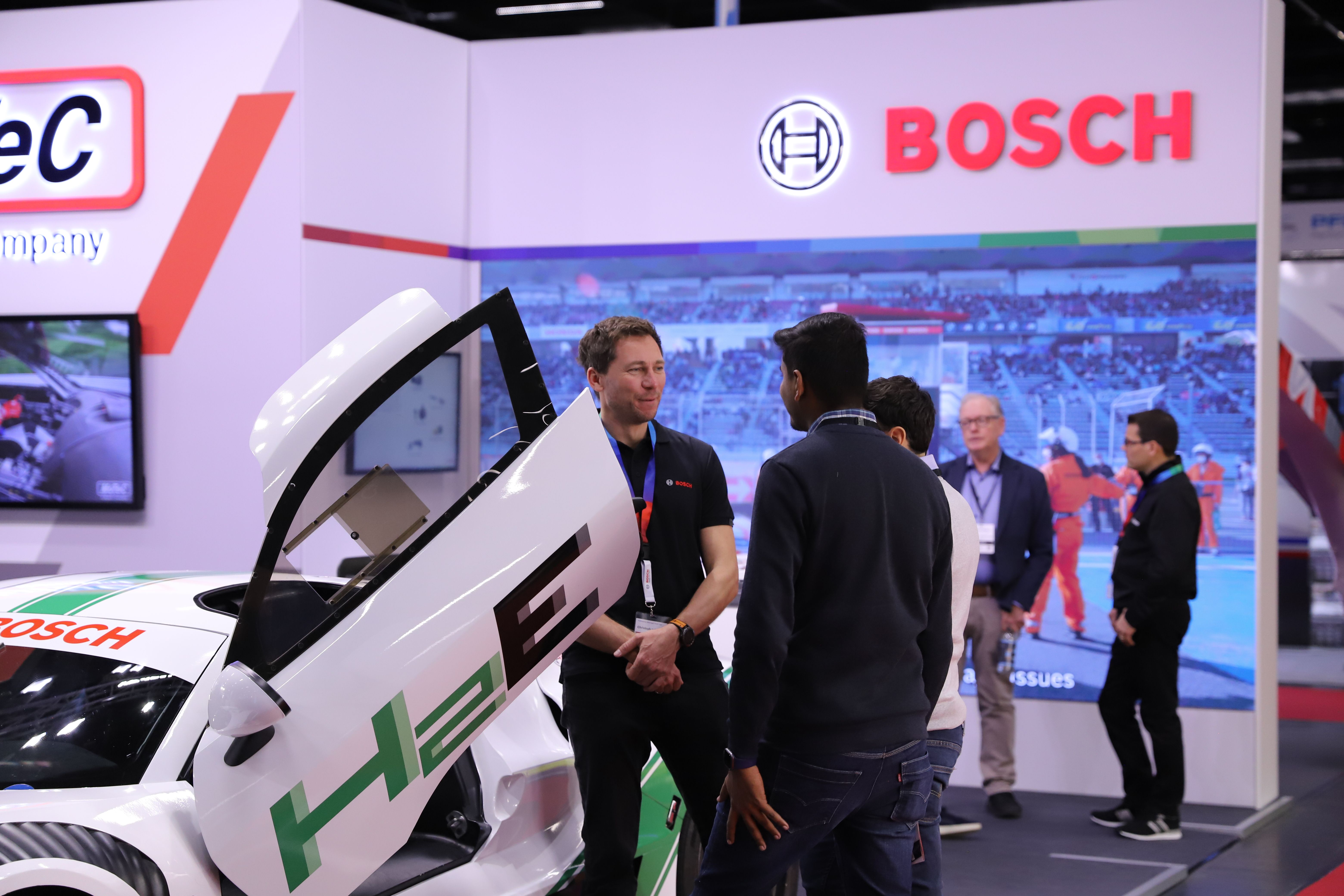 Photo shows visitors and exhibitors networking at PMW Expo