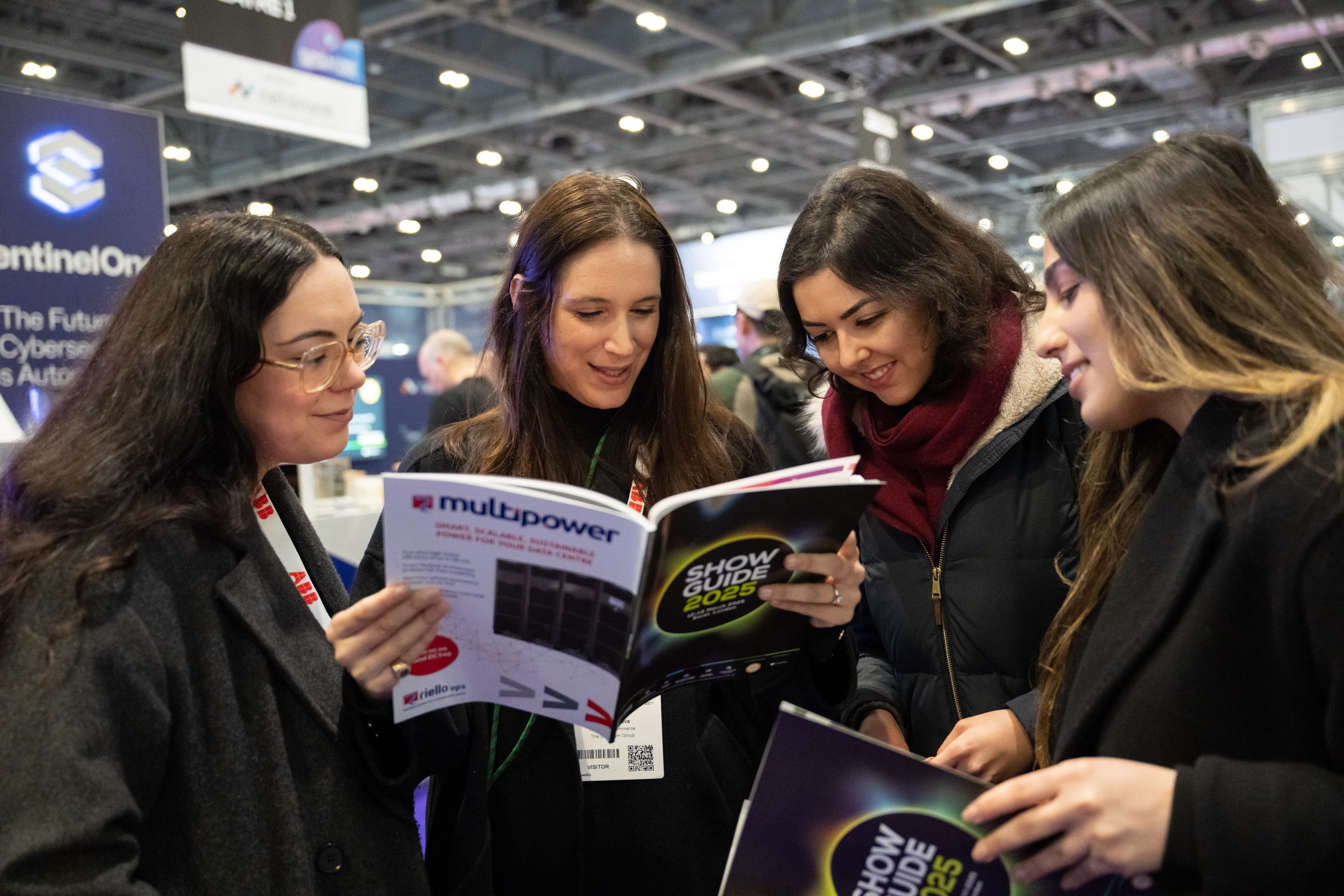 Image of People Reading Show Guide at TSL25