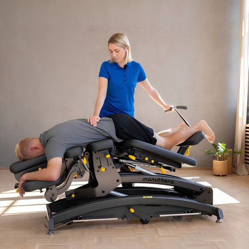 Lumbar spine soft tissue therapy and mobilization