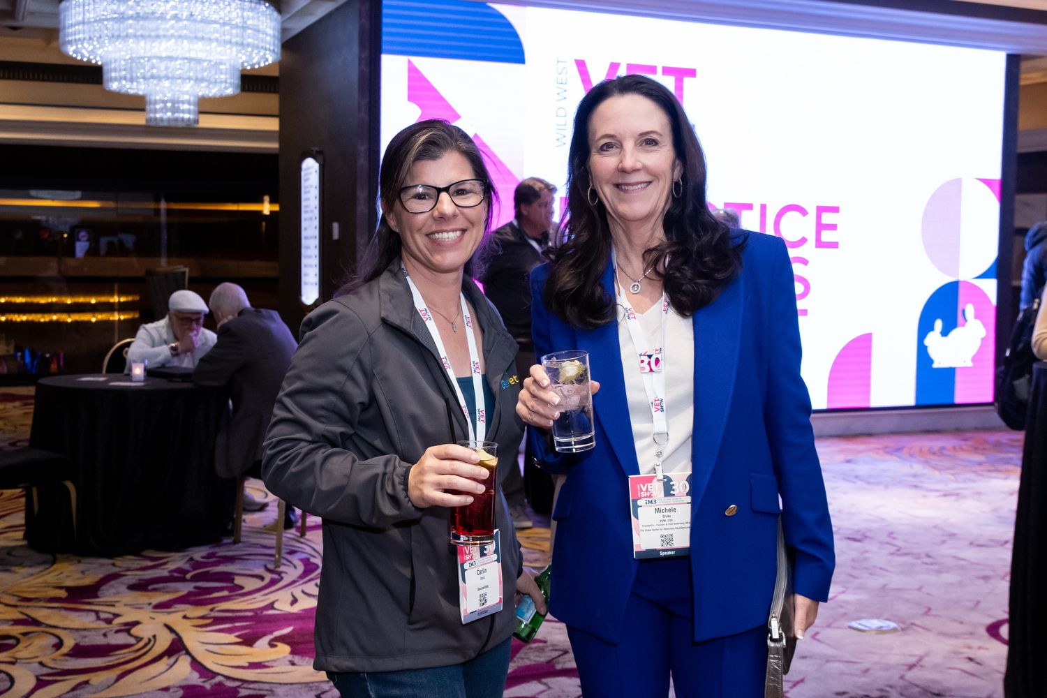 Owner and Supplier Smiling Next to Each Other