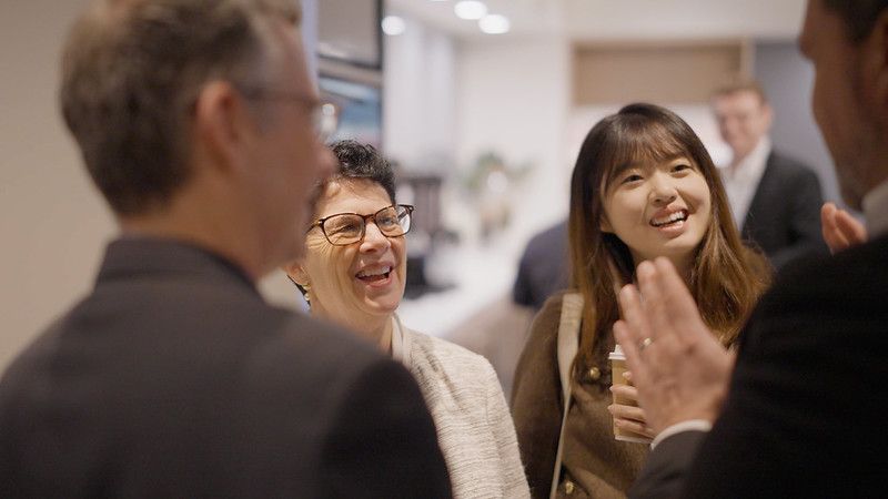Industry professionals exchanging perspectives at a networking event