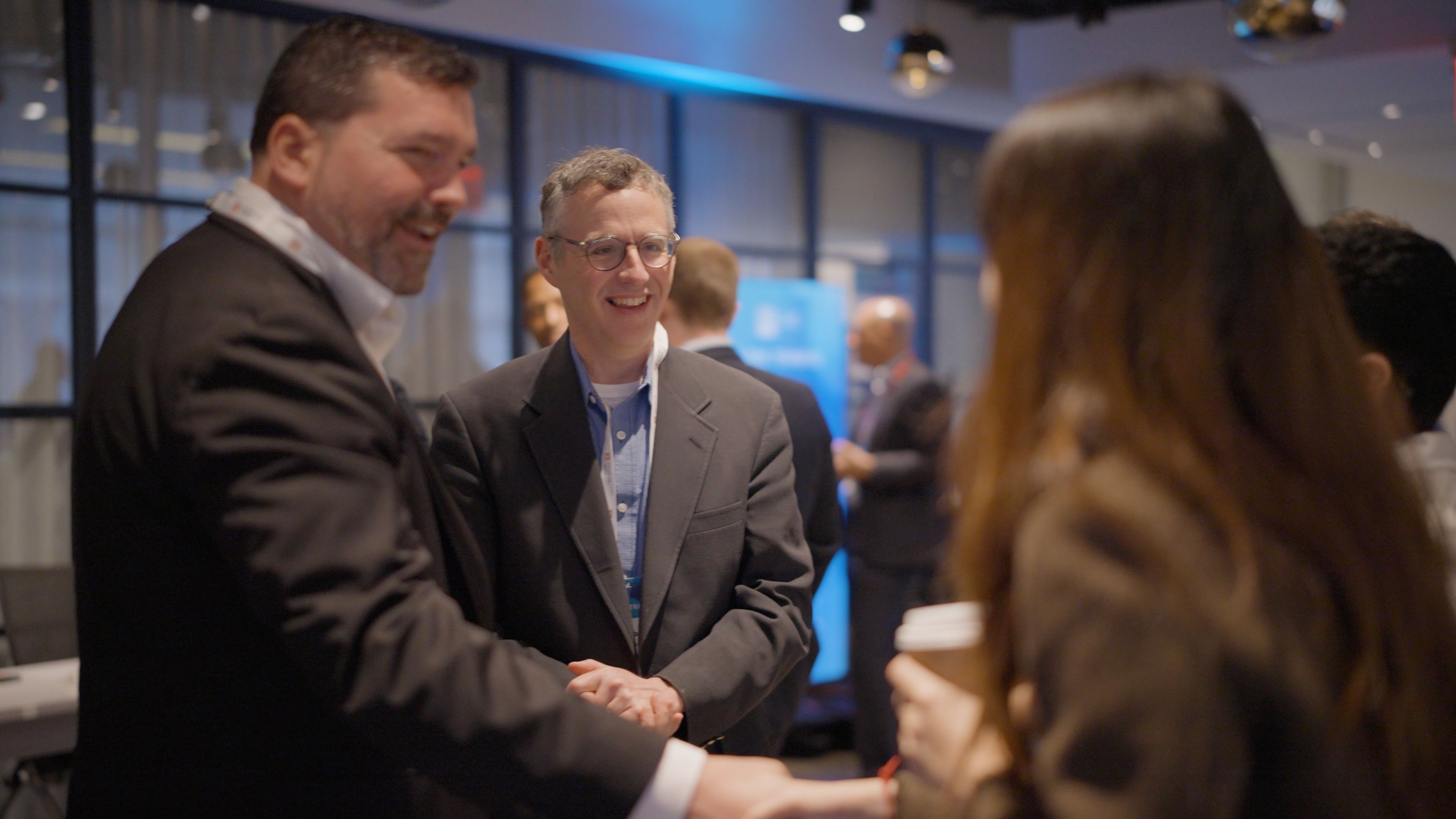 Attendees smiling & networking