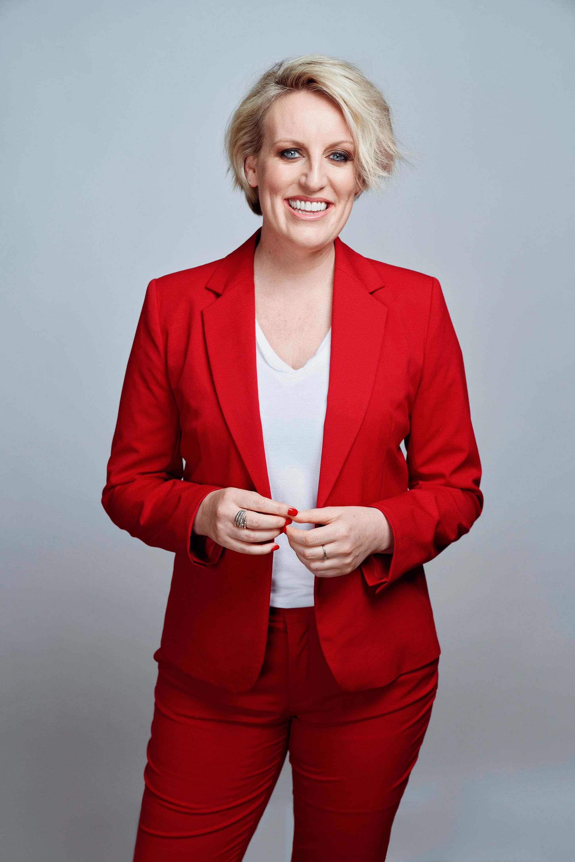Portrait shot of Steph McGovern wearing a red suit.