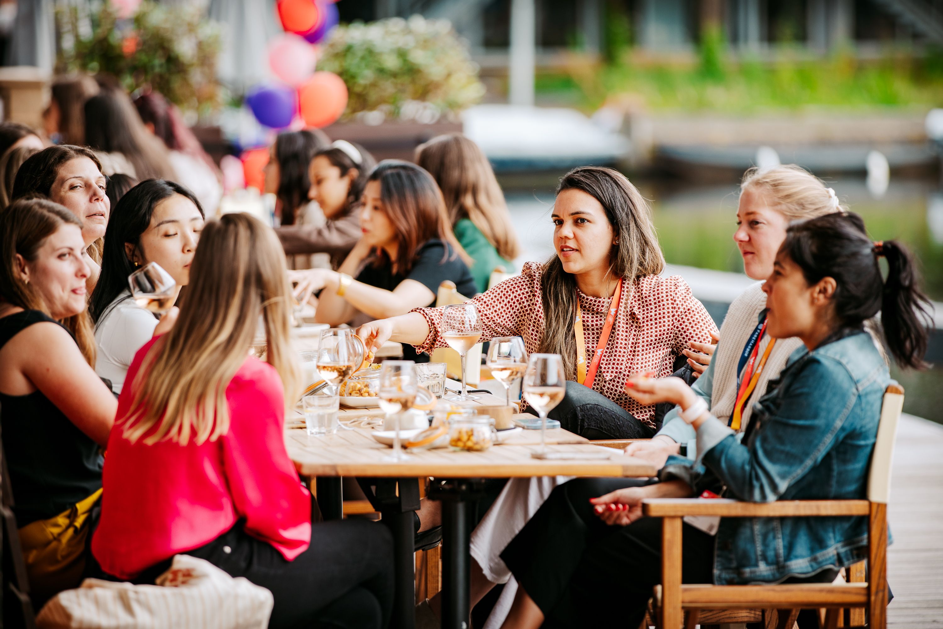 Image of women sat around a table with refreshments networking