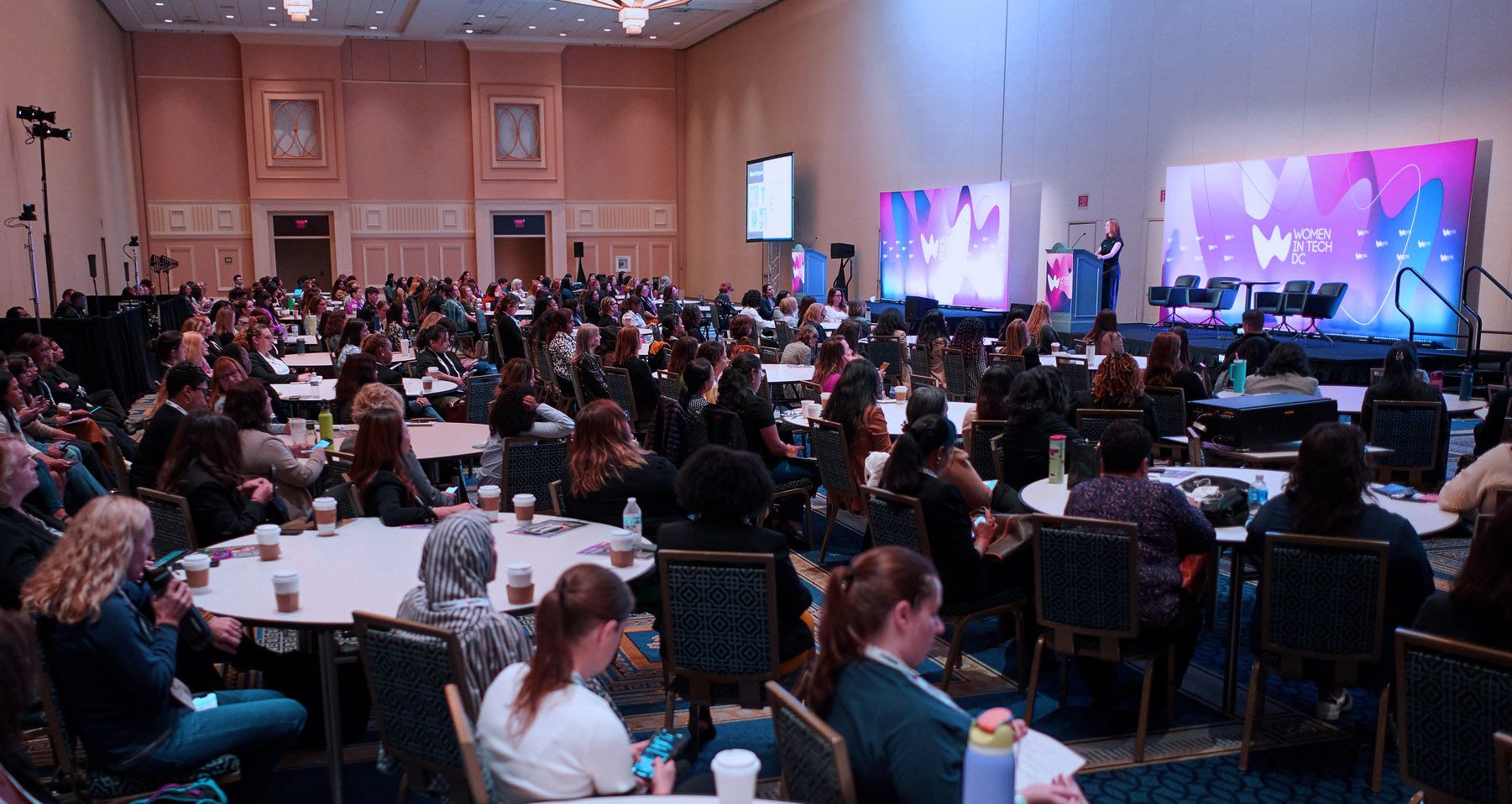 Wide shot image of the crowd and stage at Women in Tech World Series