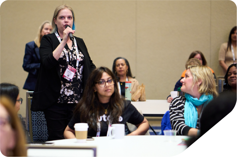 Women speaking from audience at workshop lecture