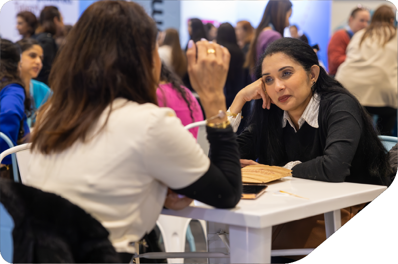 2 women speaking about careers, at the career advice hub