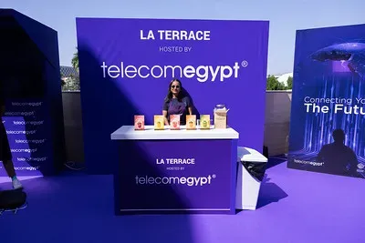 A promotional stand outdoors labeled 