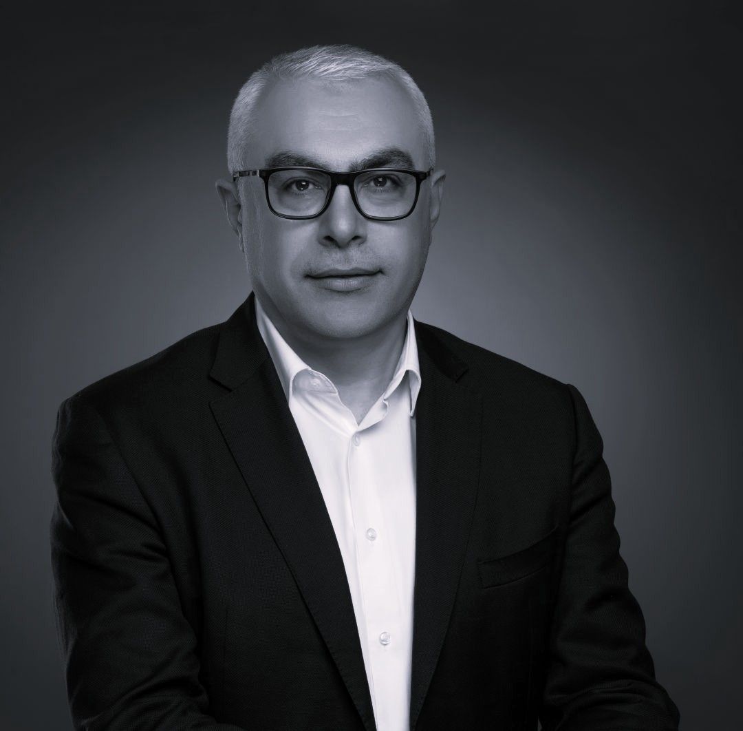 Portrait of Mazen Mroué, GLF Board Member and Chief Technology and Information Officer at MTN Group, wearing a suit and glasses.