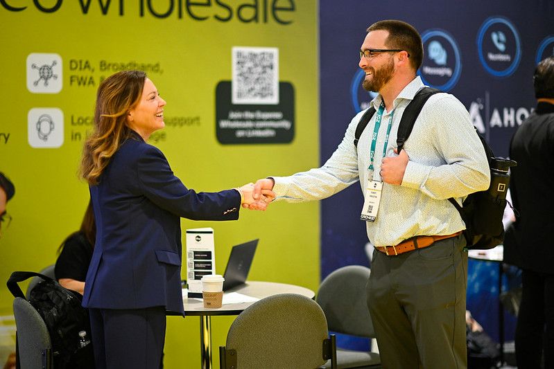 Two people shaking hands at the ITW Global event in National Harbor, MD.