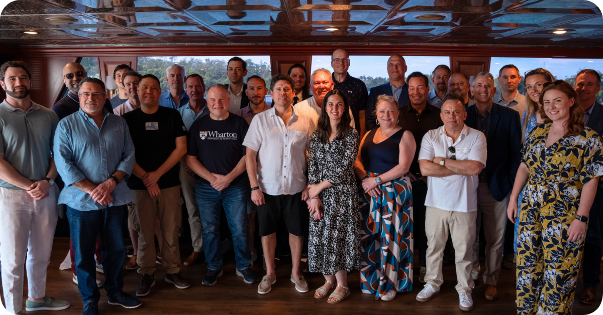 A picture taken at this year's Fiber Leaders' Forum, on a boat in Florida, showing some of the C-suite attendees taking part in a group photo.