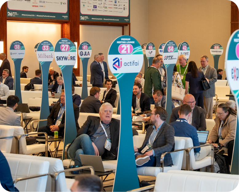 A group of professionals sitting around the meeting lounges at Metro Connect USA