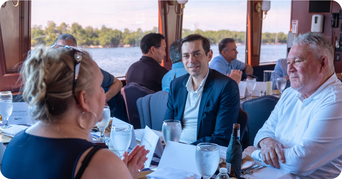 A picture taken at this year's Fiber Leaders' Forum, on a boat in Florida, showing some of the C-suite attendees taking part in a group photo.