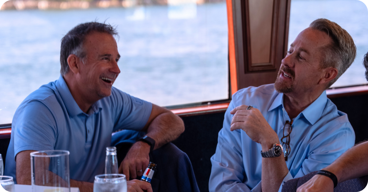 A picture taken at this year's Fiber Leaders' Forum, on a boat in Florida, showing some of the C-suite attendees taking part in a group photo.