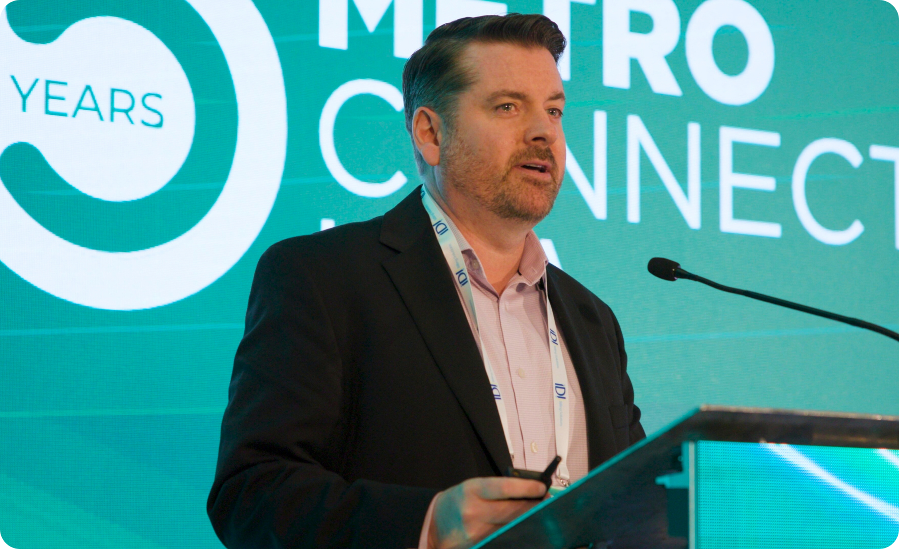 Speaker from TD Securities on stage at Metro Connect USA