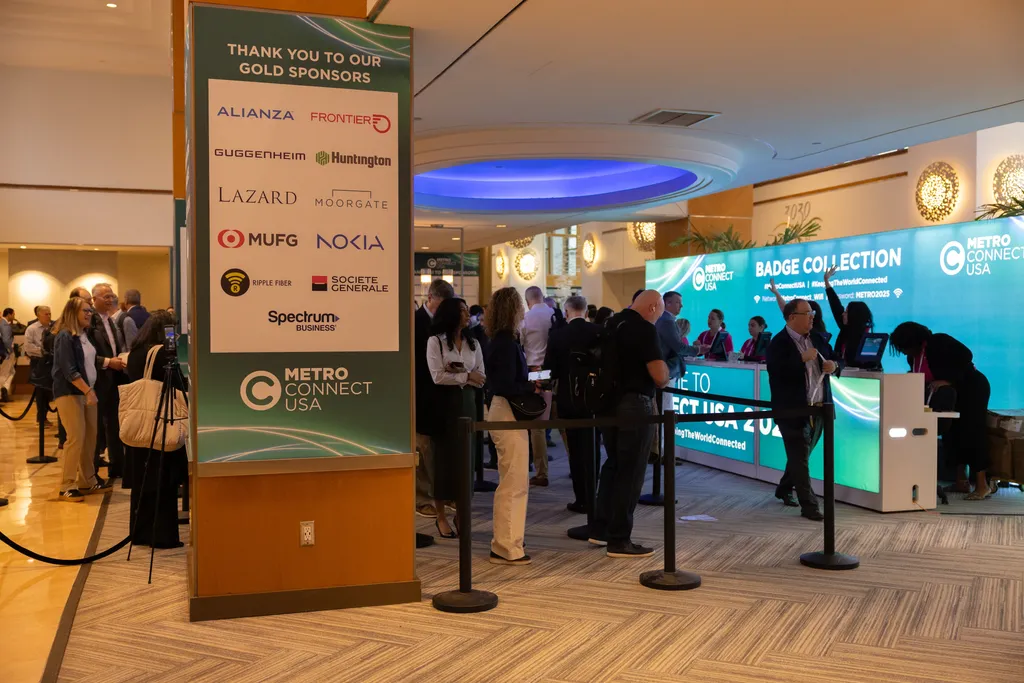 A wide view of a spacious hotel or convention lobby setup for a 