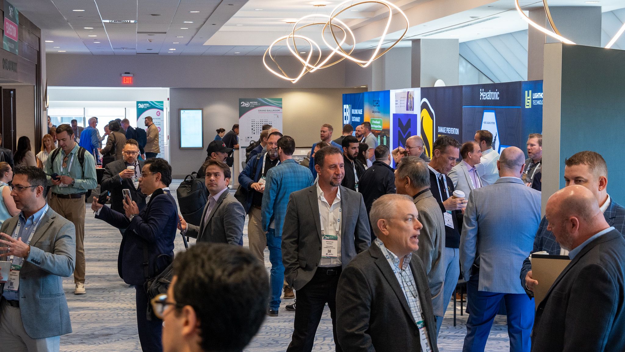 People walking the expo floor at Metro Connect