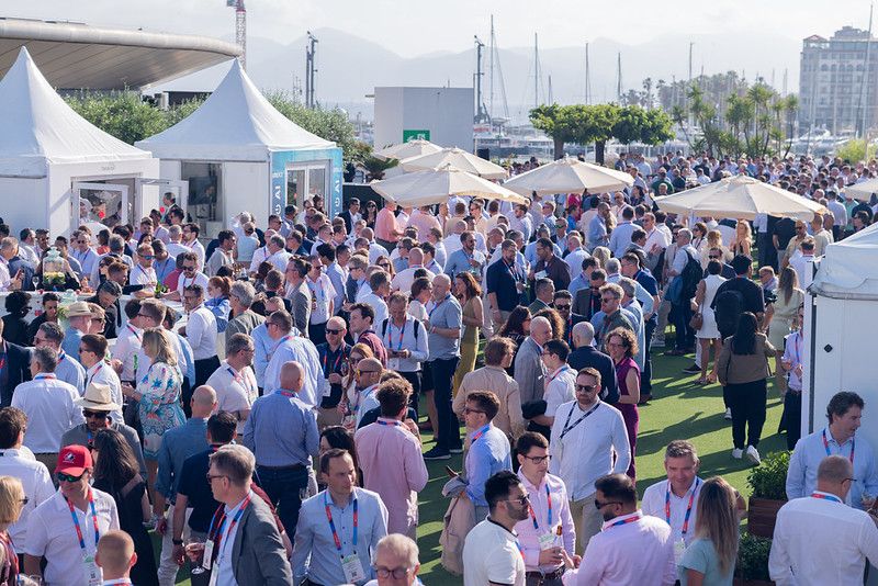 A smiling man collecting his badge