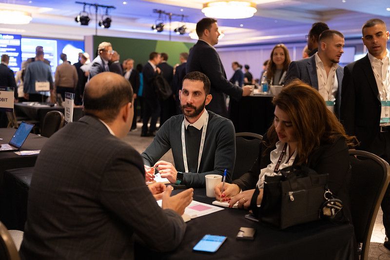 A young man and a woman at the registration desk