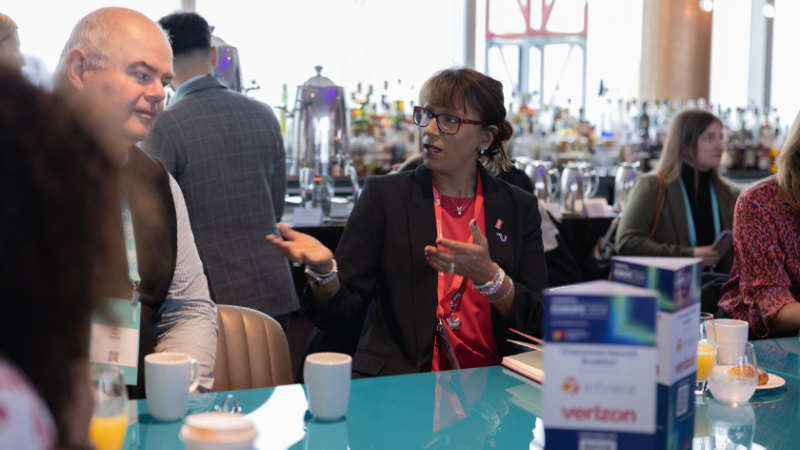 A woman talking to a man