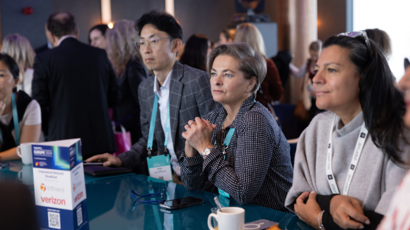 Two women are listening the discussion