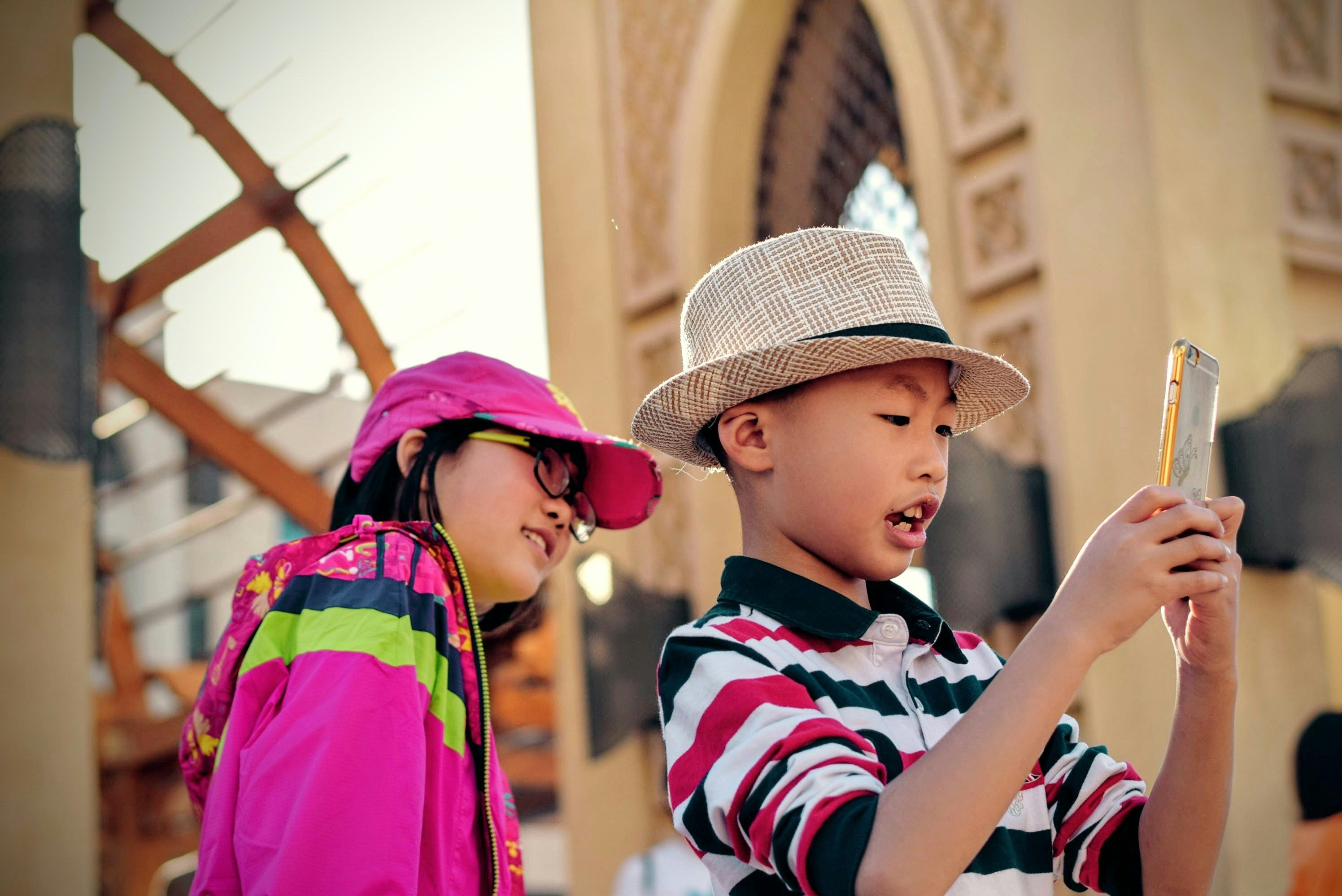 Two Children Playing with a Smartphone