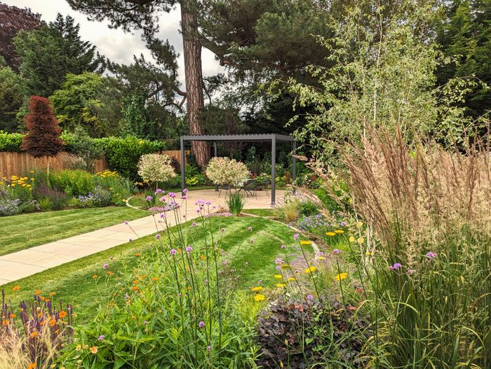 Colourful garden with outdoor pergola