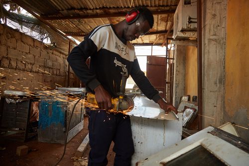 Electricity access is crucial for Avelino Martins carpentry business in Luanda Angola 
