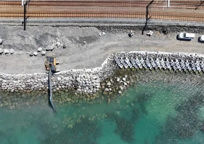 XBloc® revetment constructed underwater with long reach and grapple, March 2024