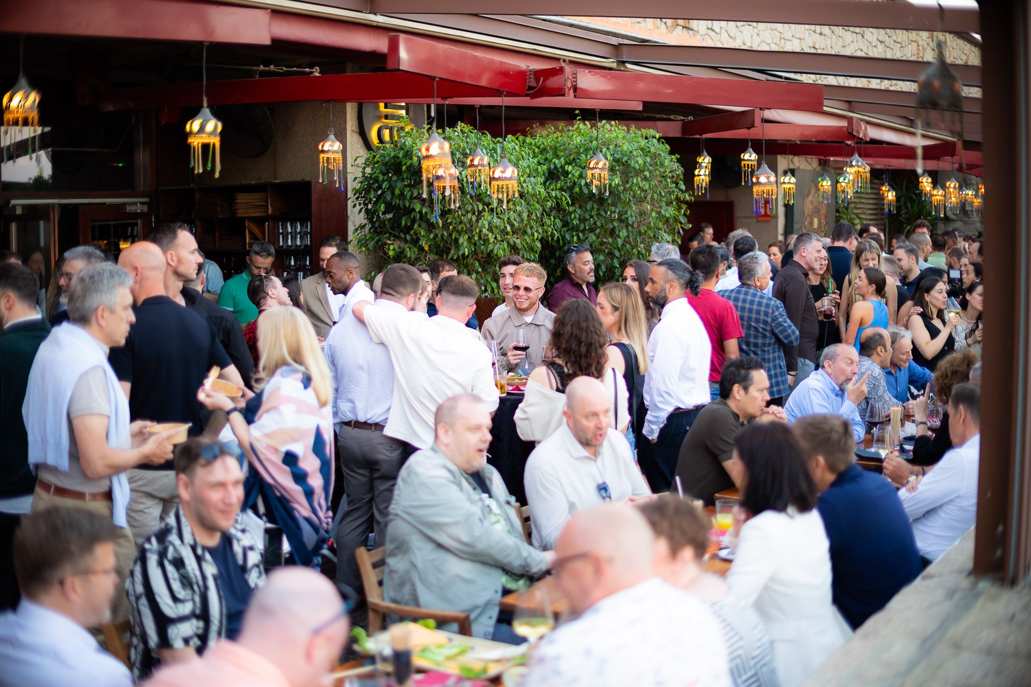 Guests networking over evening drinks