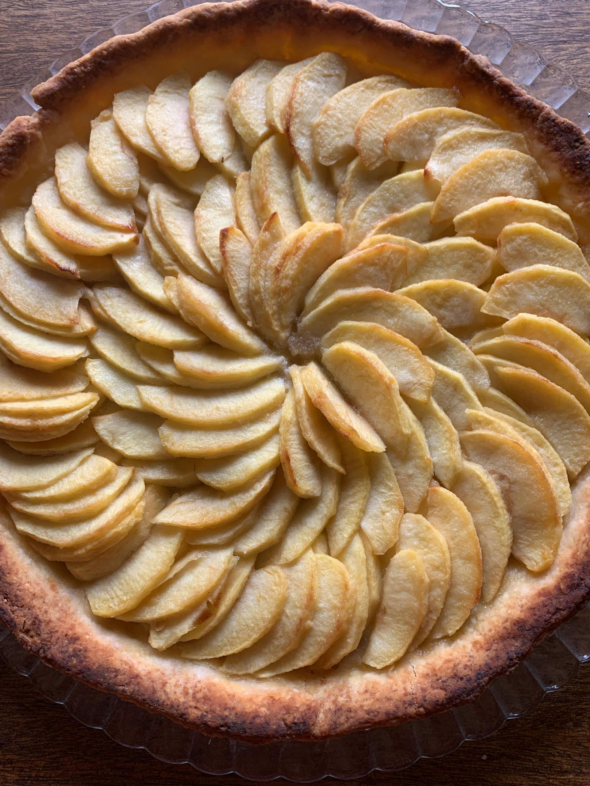 cake with sliced apples on top