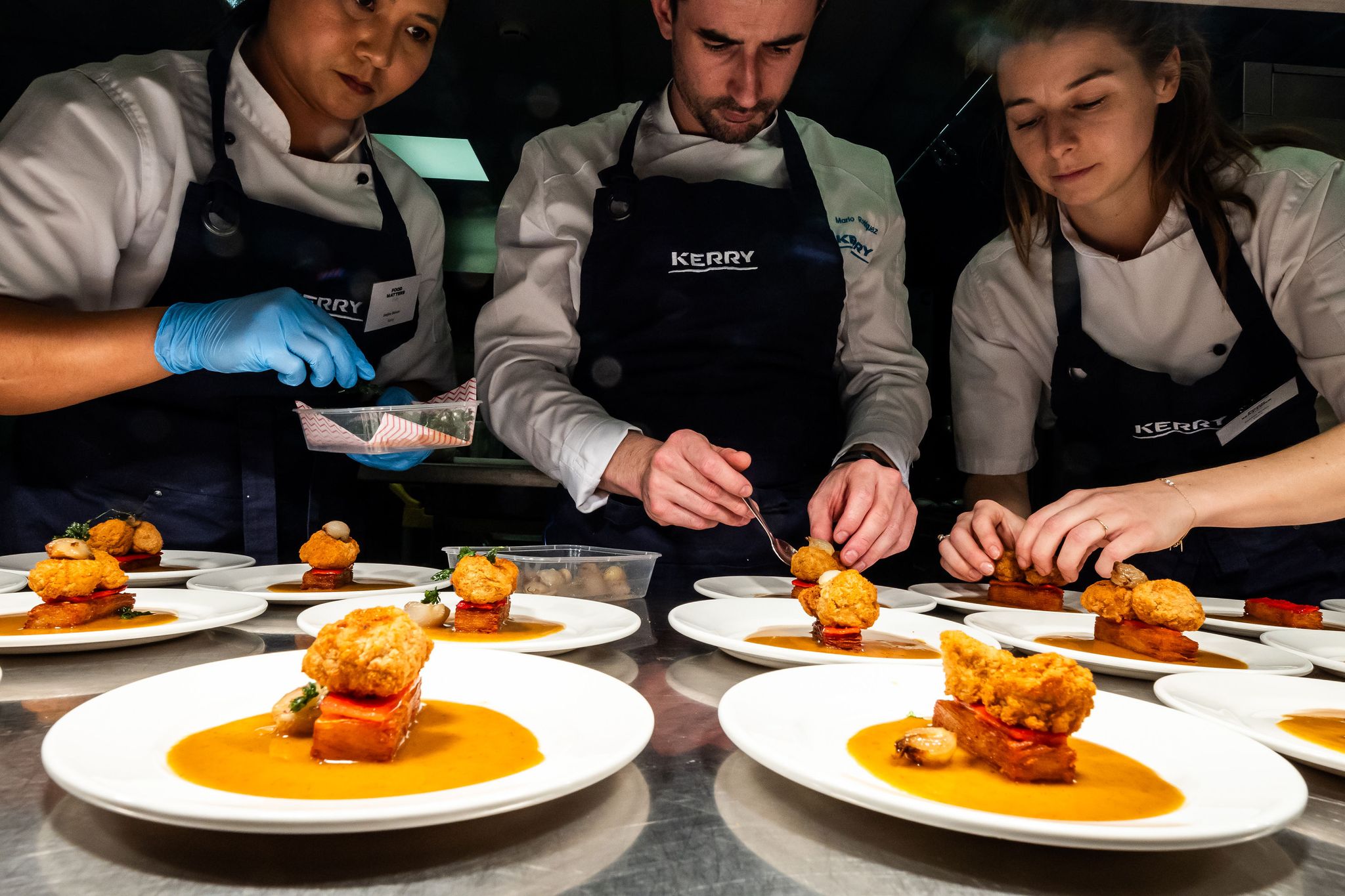 chefs preparing dishes 