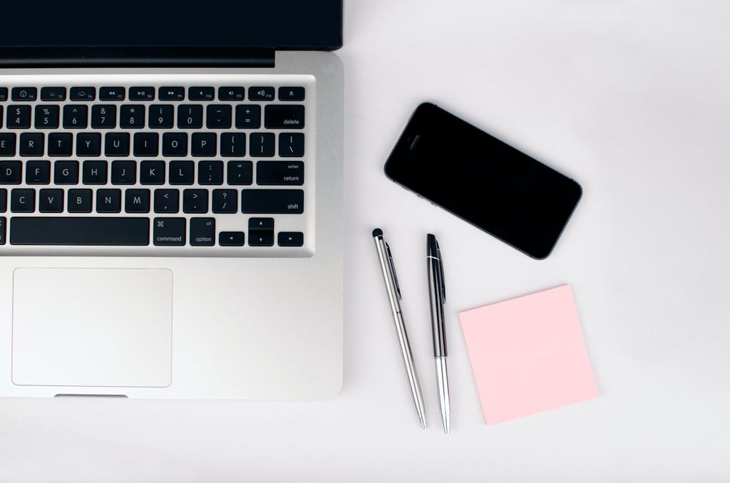 laptop and mobile phone on a desk