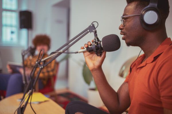 man speaking into a microphone