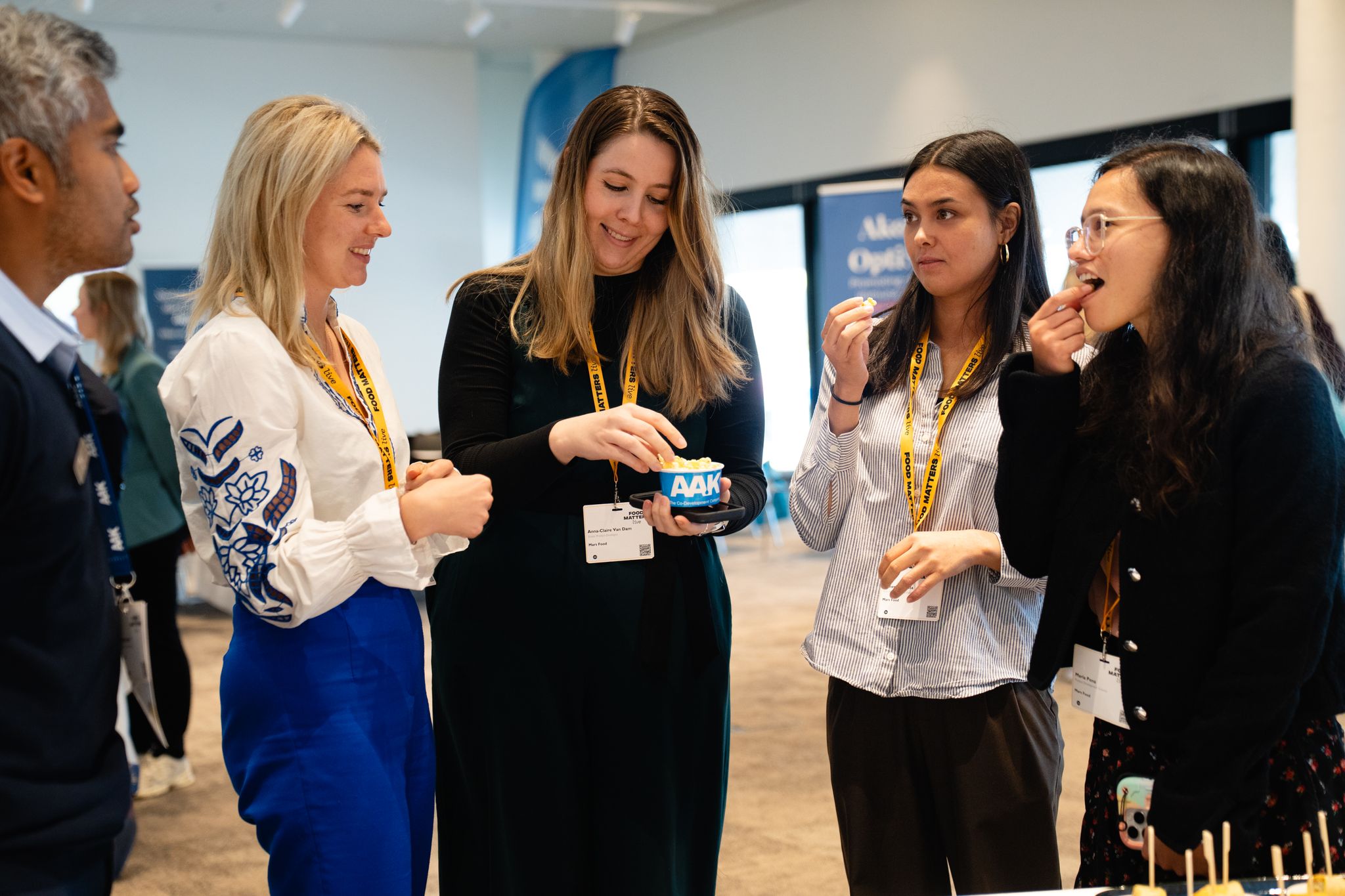 group of people tasting food