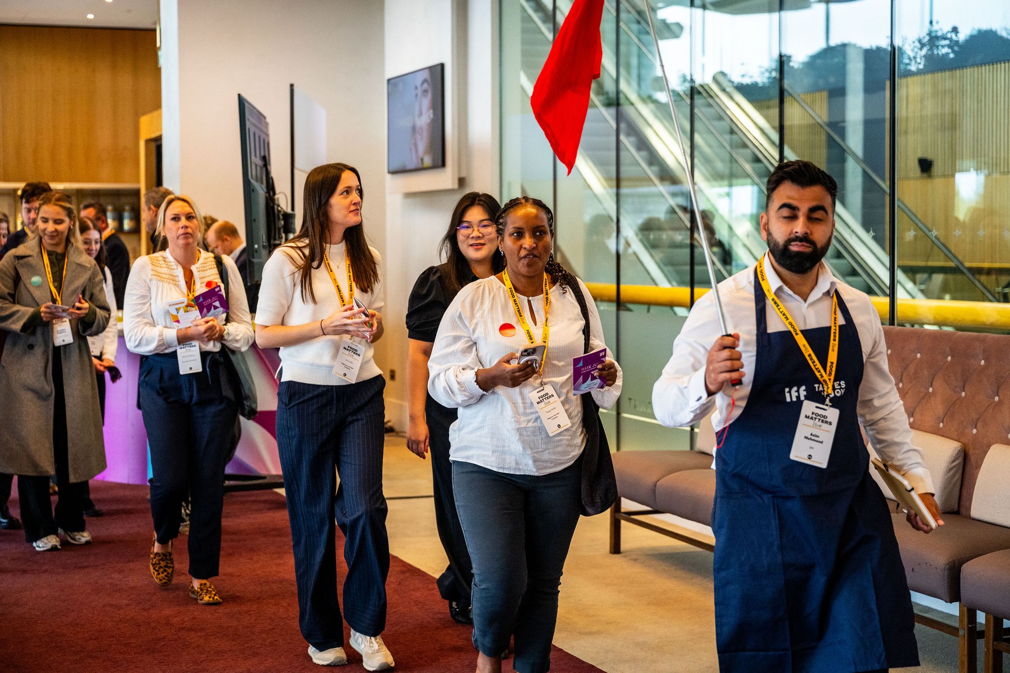 people walking holding bunting