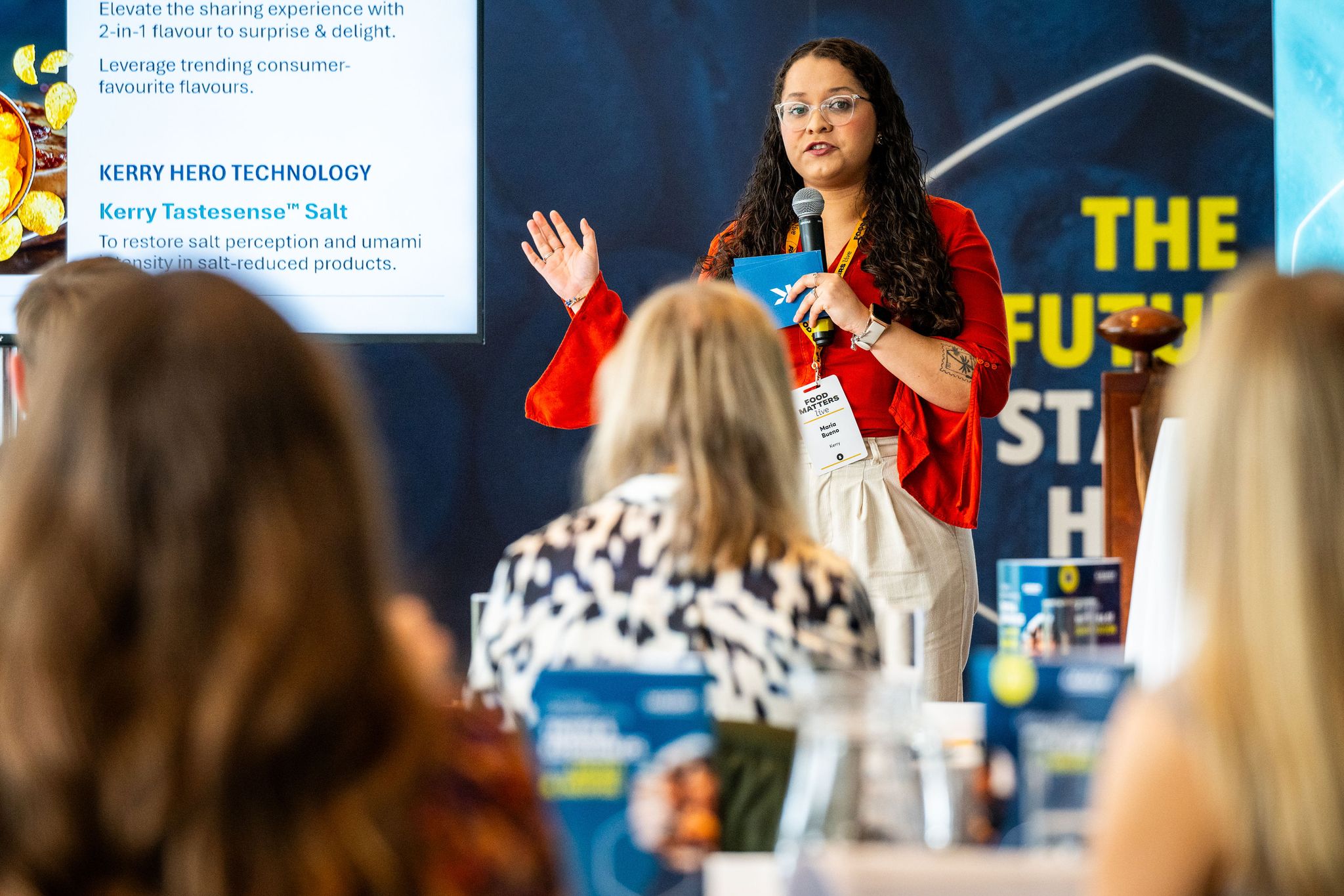woman presenting on stage