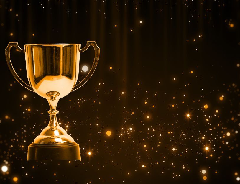 A trophy on a sparkling background