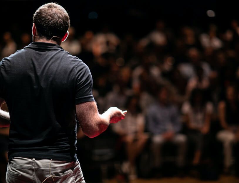 Man speaking in front of audience