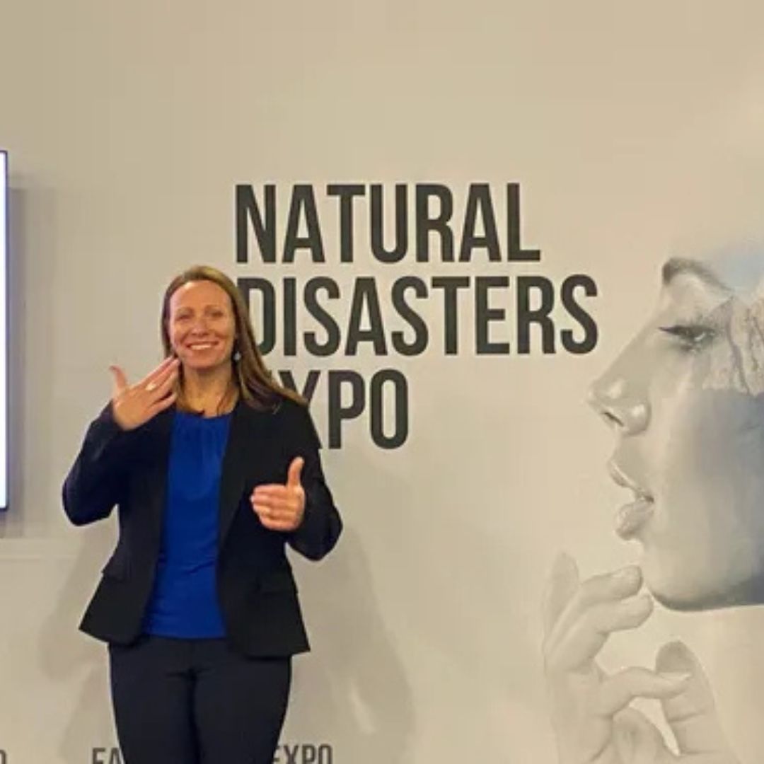 Woman doing sign language during a presentation at the natural disasters expo