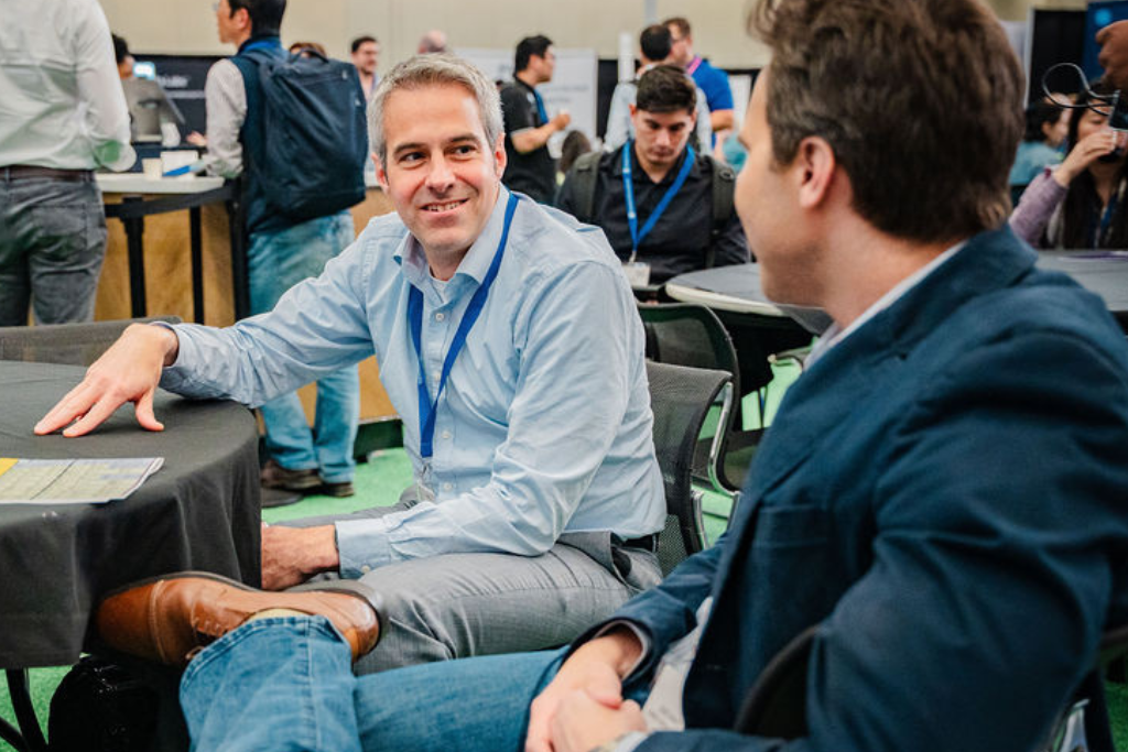 Man at roundtable smiling