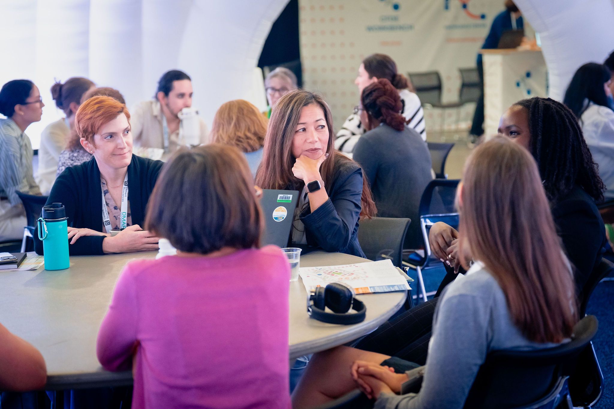 people at a round table talking